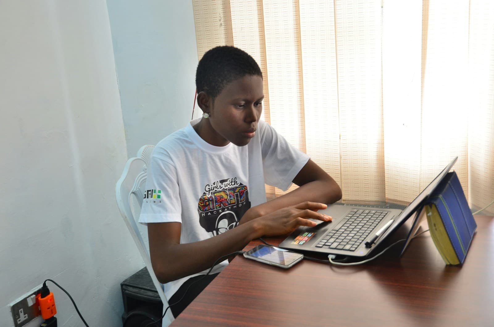 A young man working at a desktop computer
